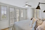 Inviting King Guest Bedroom with French Doors and Windows 